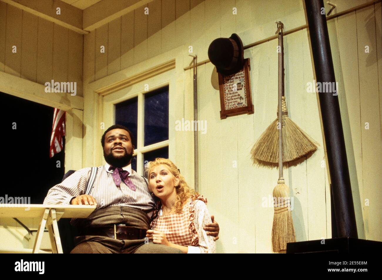 Clive Rowe (Enoch Snow), Katrina Murphy (Carrie Pipperidge) in CAROUSEL by Rodgers & Hammerstein at the Shaftesbury Theatre, London WC1  10/09/1993        a National Theatre production  music: Richard Rodgers  book & lyrics: Oscar Hammerstein II  design: Bob Crowley  lighting: Paul Pyant  choreography: Kenneth MacMillan  director: Nicholas Hytner Stock Photo