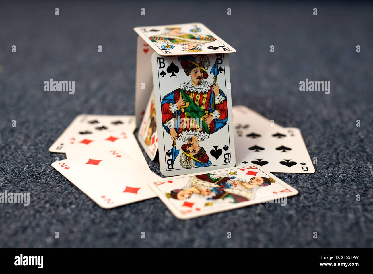 House of cards on gray background at home Stock Photo