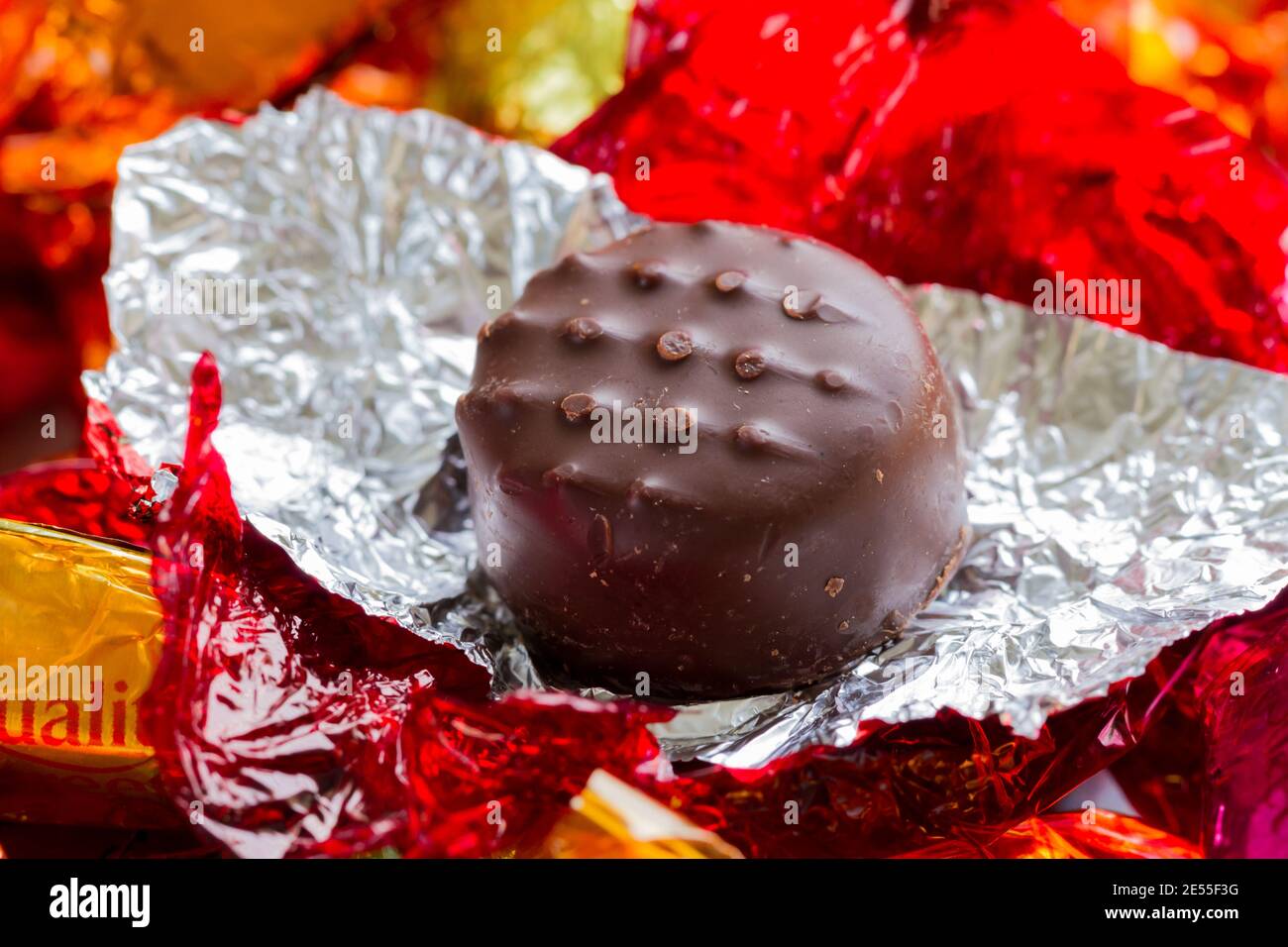 Quality Street strawberry cream chocolate sweet unwrapped closeup Stock Photo