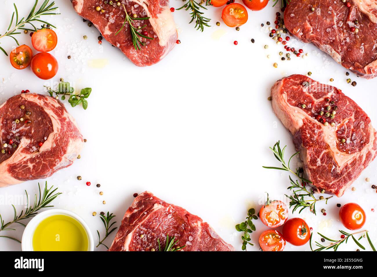 raw ribeye steaks with different spices and olive oil Stock Photo Alamy
