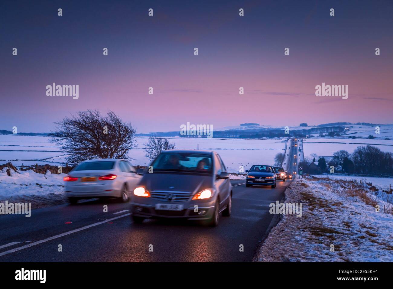 Driving on a winter evening. Stock Photo