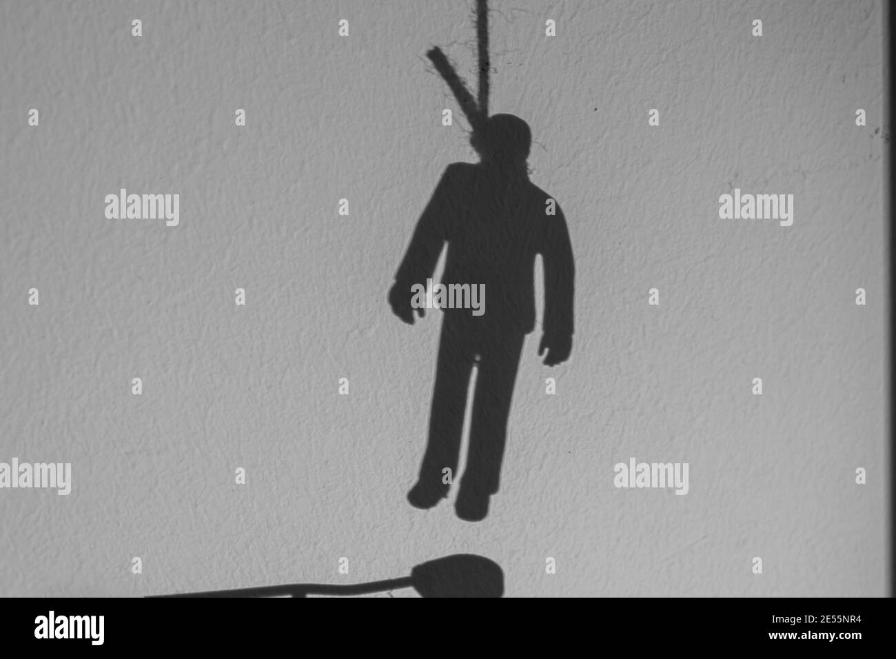 Shadow of depressed man hanging suicide Stock Photo