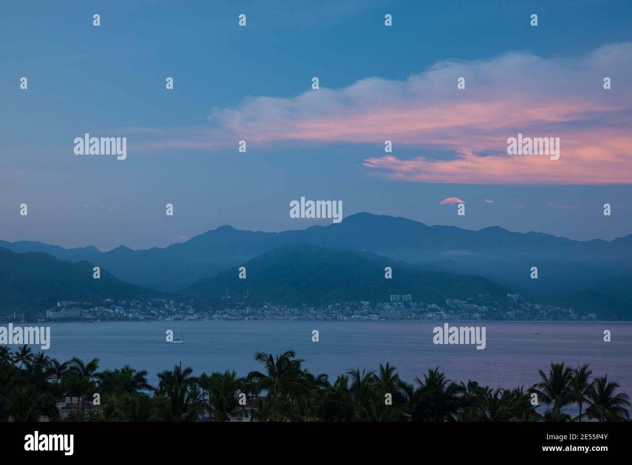 Bay of Banderas and downtwon Puerto Vallarta at dawn from Velas Vallarta Hotel; Puerto Vallarta, Jalisco, Mexico. Stock Photo