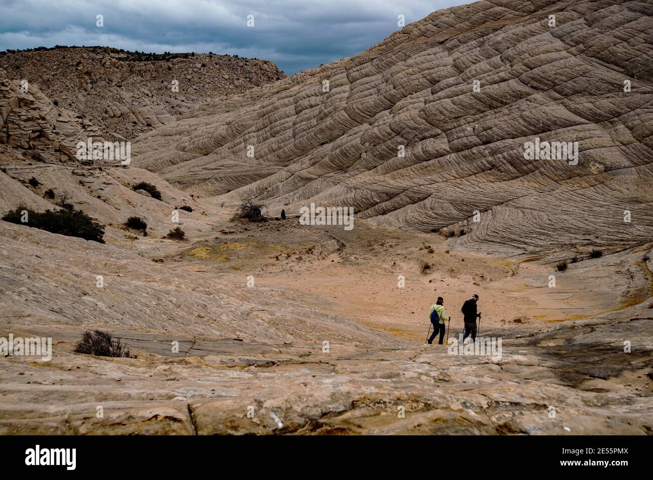 Couple hiking in the remote area of Snow Canyon State Park, Utah, USA. This area provides numerous adventures for those who like an adventure. Stock Photo