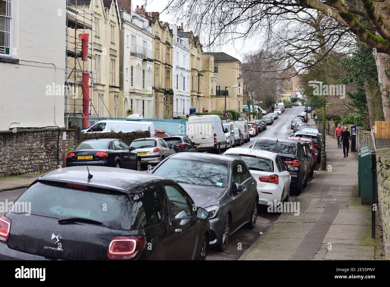 City residential street packed with cars parked on both sides, UK Stock Photo