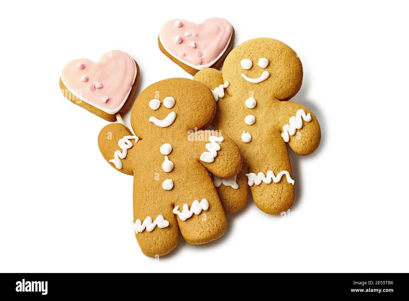 Gingerbread cookies shaped as man and heart on white Stock Photo