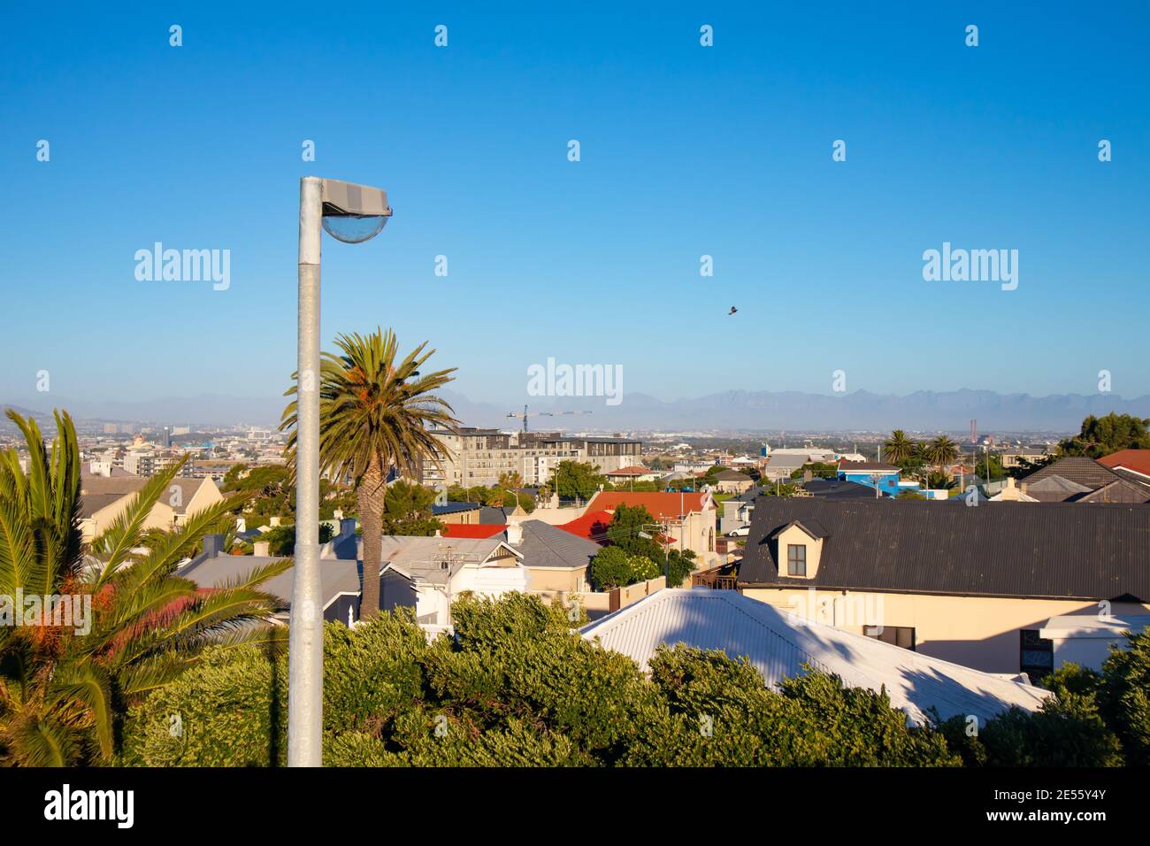 Nelson Mandela Boulevard- Cape Town, South Africa - 25-01-2021 Street lamp next to Nelson Mandela Boulevard on a warm afternoon. Sun setting over city Stock Photo
