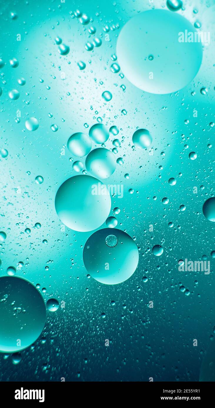 oil with bubbles on dark blue background. Abstract space background. Soft  selective focus. macro of oil drops on water surface. copy space. air  bubble Stock Photo - Alamy