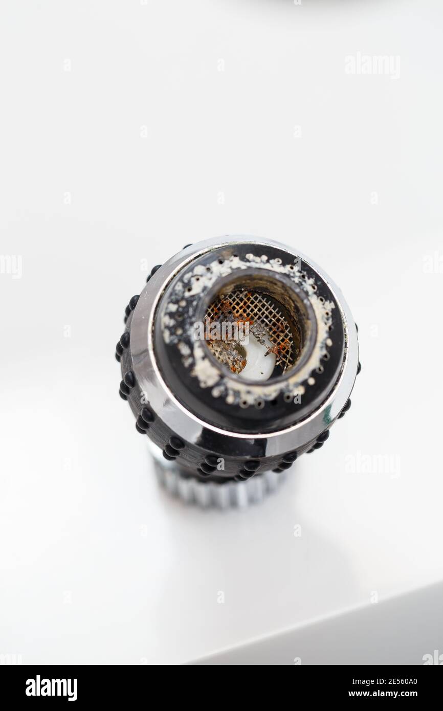 Old faucet aerator closeup on a white background. Broken sink mixer Stock Photo Alamy