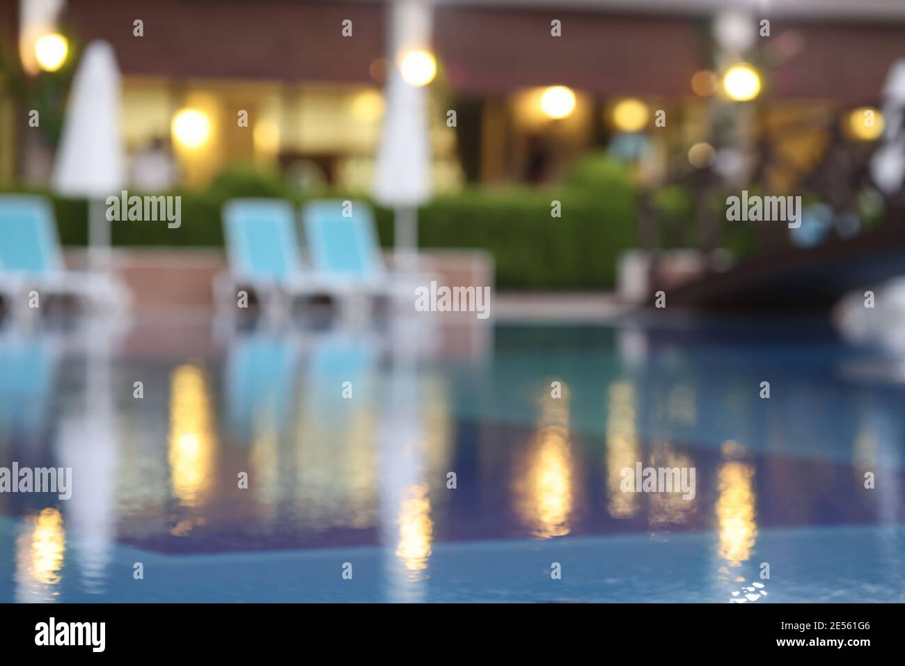 Evening blurred background of resort hotel and pool Stock Photo