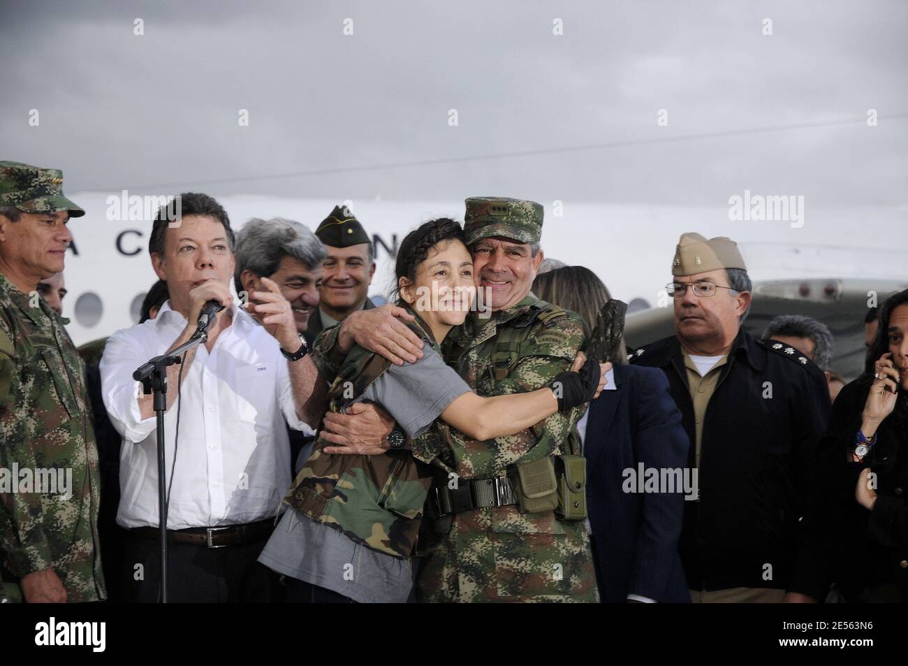 Colombia's Defense Minister Juan Manuel Santos spaking next to the commander of Colombia's Army, Gen. Mario Montoya, right, and former hostage Ingrid Betancourt as Defense Minister Juan Manuel Santos stands besides after Betancourt's arrival to a military base in Bogota, Colombia on July 2, 2008 after being rescued from six years of captivity. Betancourt is one of 15 hostages rescued by Colombia's military from the Revolutionary Armed Forces of Colombia, or FARC. Photo by Reina/ABACAPRESS.COM Stock Photo