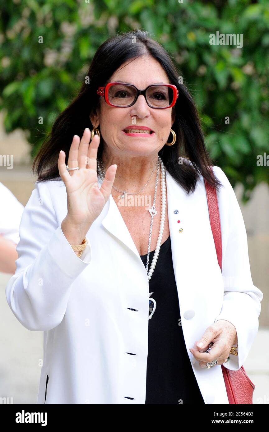 Nana Mouskouri poses in the courtyard of the Elysee Palace in Paris, France  on July 3, 2008, prior to attend a ceremony awarding designer Giorgio  Armani, actress Claudia Cardinale and singer Tina