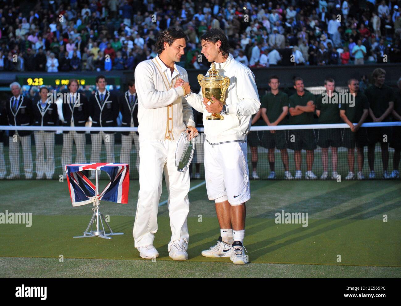 Spain's Rafael Nadal right, stands with the winners trophy next to  Switzerland's Roger Federer after their final tennis match of the 2008  Wimbledon championships against at The All England Tennis Club in