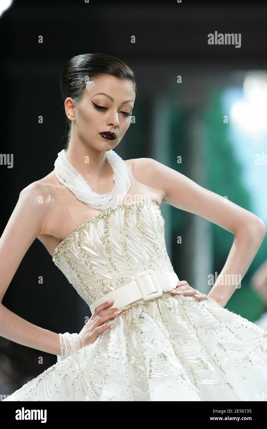 Morgane Dubled displays a creation by British designer John