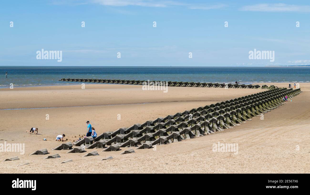 Modern sea defences on Wallasey beach. Stock Photo
