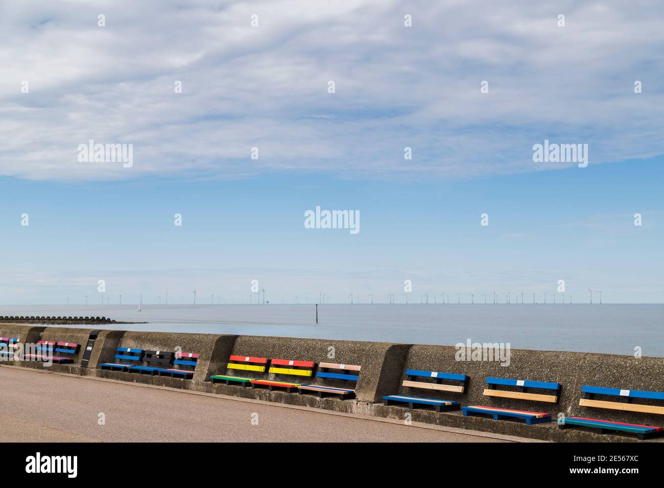 Colourful benches on Wallasey beach promenade. Stock Photo