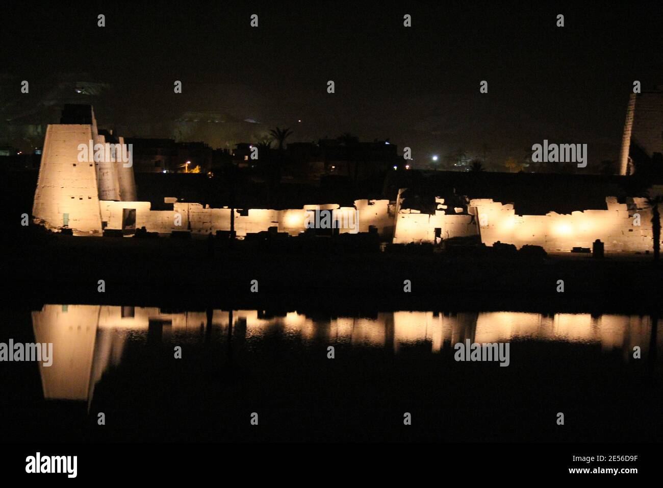 Illuminated great Amun temple of Karnak at night, Luxor, Egypt Stock Photo