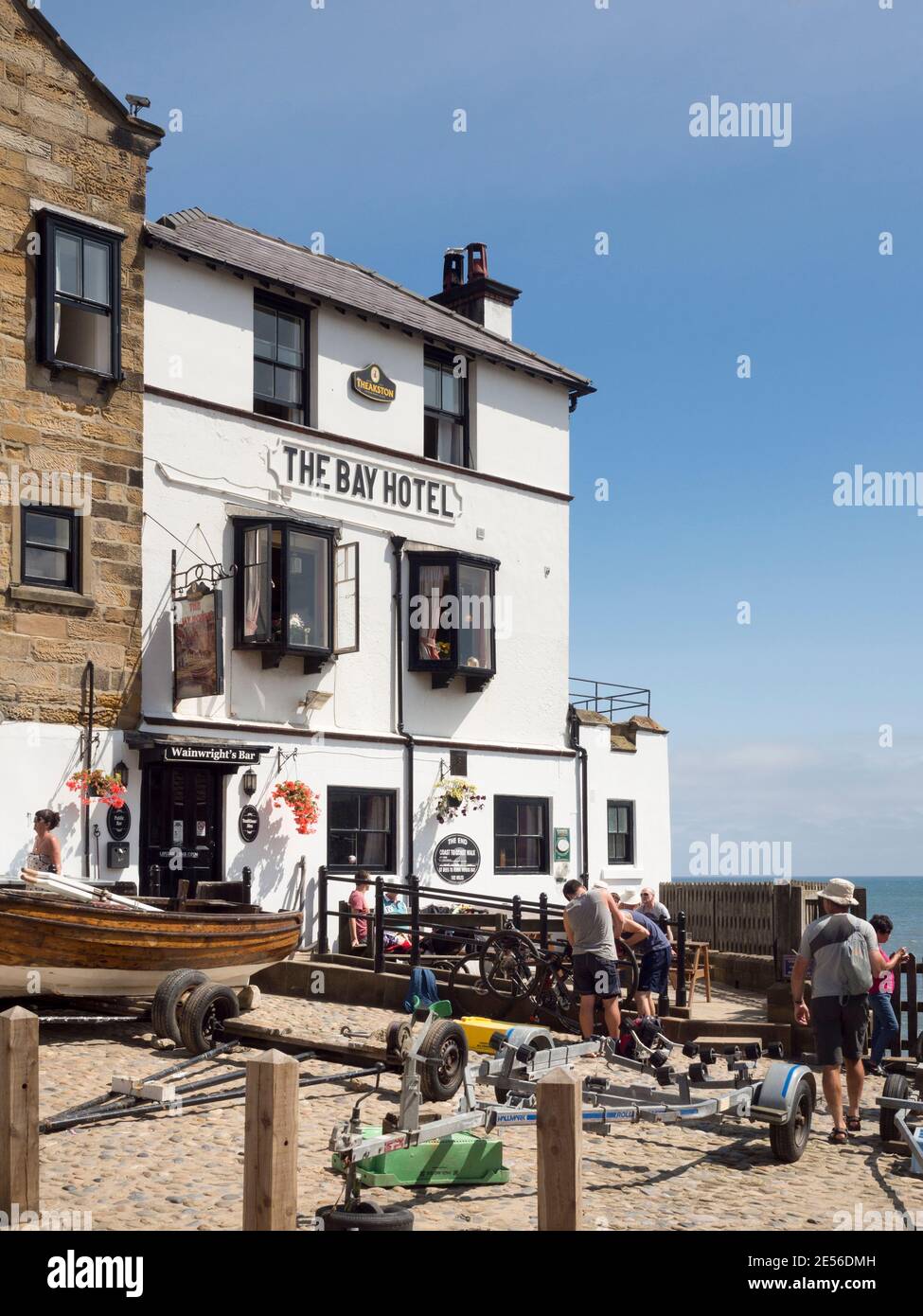 The Bay Hotel at the end of the Coast to Coast footpath in Robin Hood's Bay on the Yorkshire coast. Stock Photo