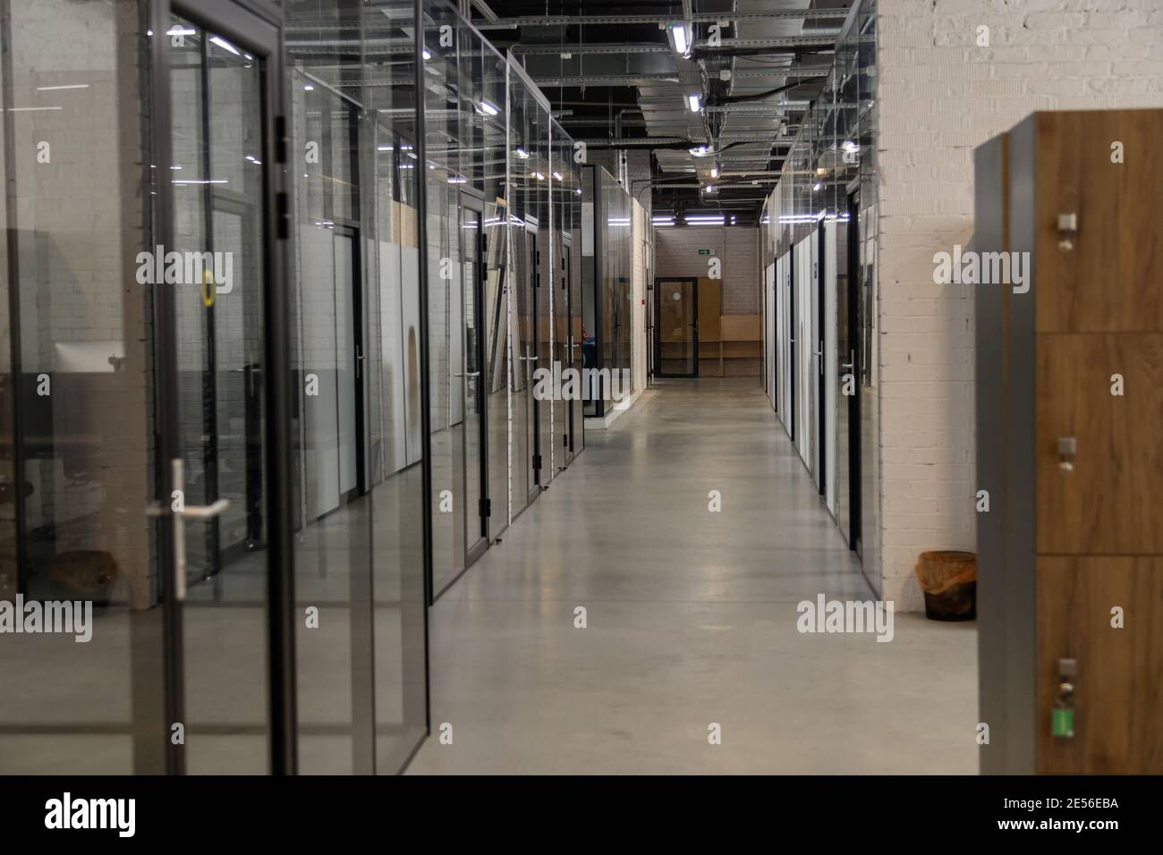 Modern empty office with glass partitions, loft style interior. Perspective view Stock Photo