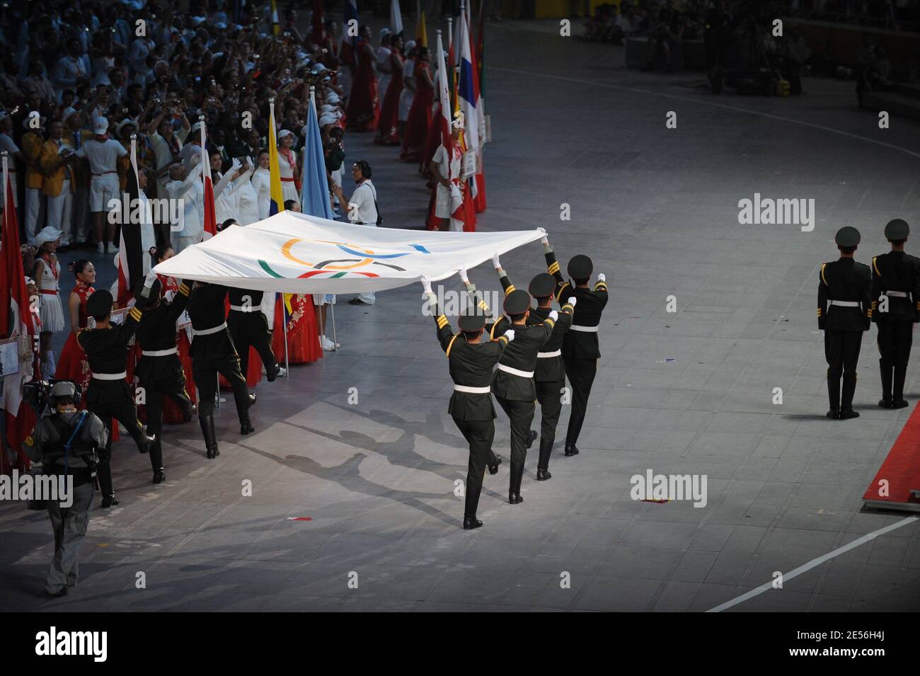 Members of the Chinese military raise the Olympic flag next the China flag during the Opening Ceremony for the 2008 Beijing Summer Olympics at the National Stadium Stock Photo