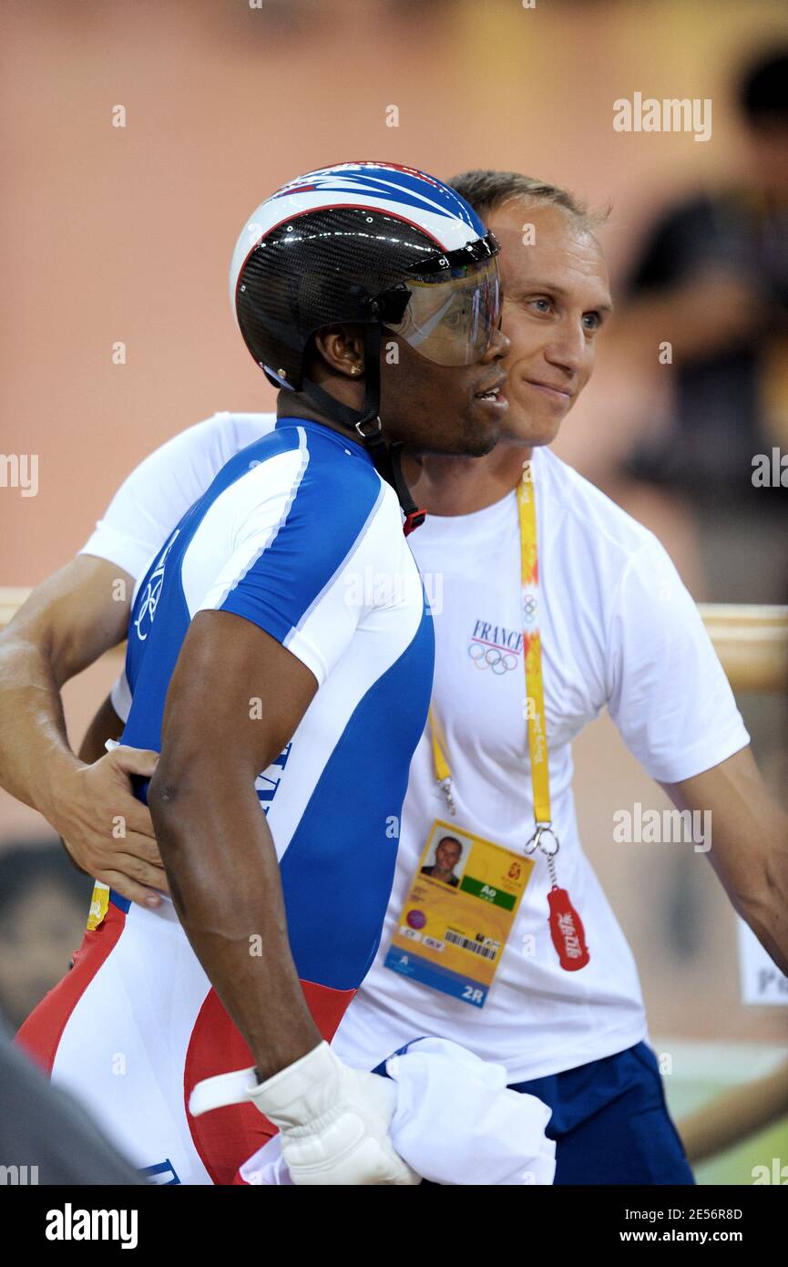 France's Gregory Bauge wins the silver medal on men's team sprint and is congratulated by Florian Rousseau during the Beijing Olympic Games Day 7 at the Laoshan Velodrome in Beijing, China on August 15, 2008. Photo by Gouhier-Hahn-Nebinger/Cameleon/ABACAPRESS.COM Stock Photo