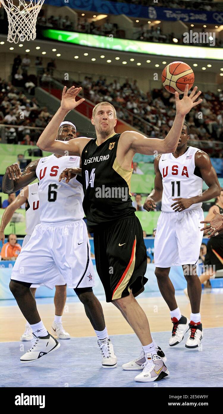 dpa) - German basketball star Dirk Nowitzki warms up ahead of the  basketball match Germany vs USA in Cologne, Germany, 4 August 2004. The  Olympic 'Dream Team' from the United States closely