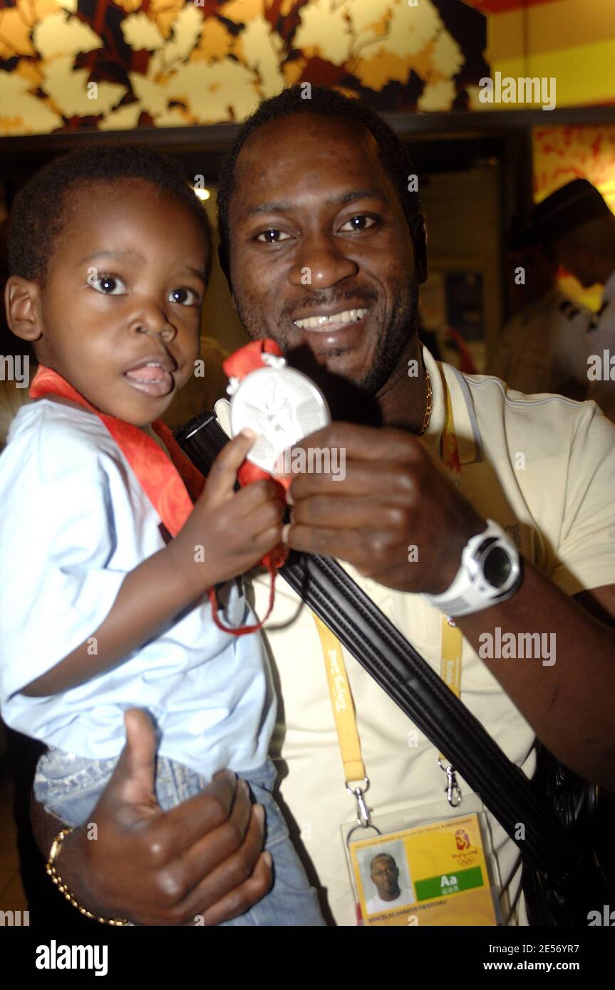 France's Vencelas Dabaya arrives at the Roissy airtport in Paris, France on August 21, 2008. Vencelas Dabaya won the Men's -69kg weightlifting Silver Medal. Photo by Giancarlo Gorassini/Cameleon/ABACAPRESS.COM Stock Photo