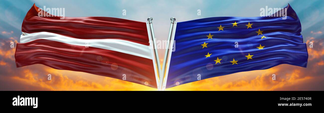 European Union Flag and Latvia flag waving with texture sky Cloud and sunset Double flag Stock Photo