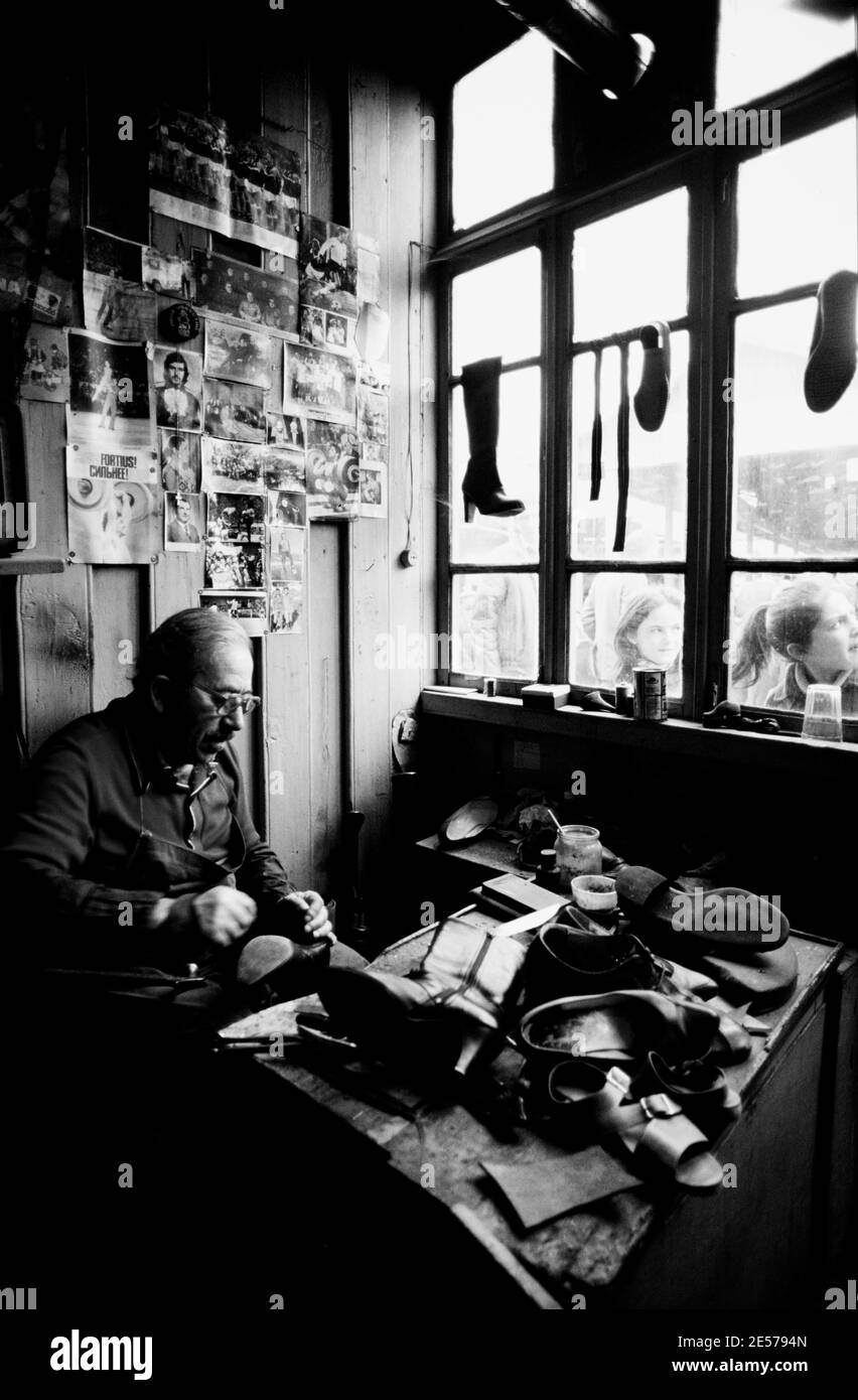 A cobbler works in his shop in Tbilisi, Soviet Georgia - 1990 Stock Photo