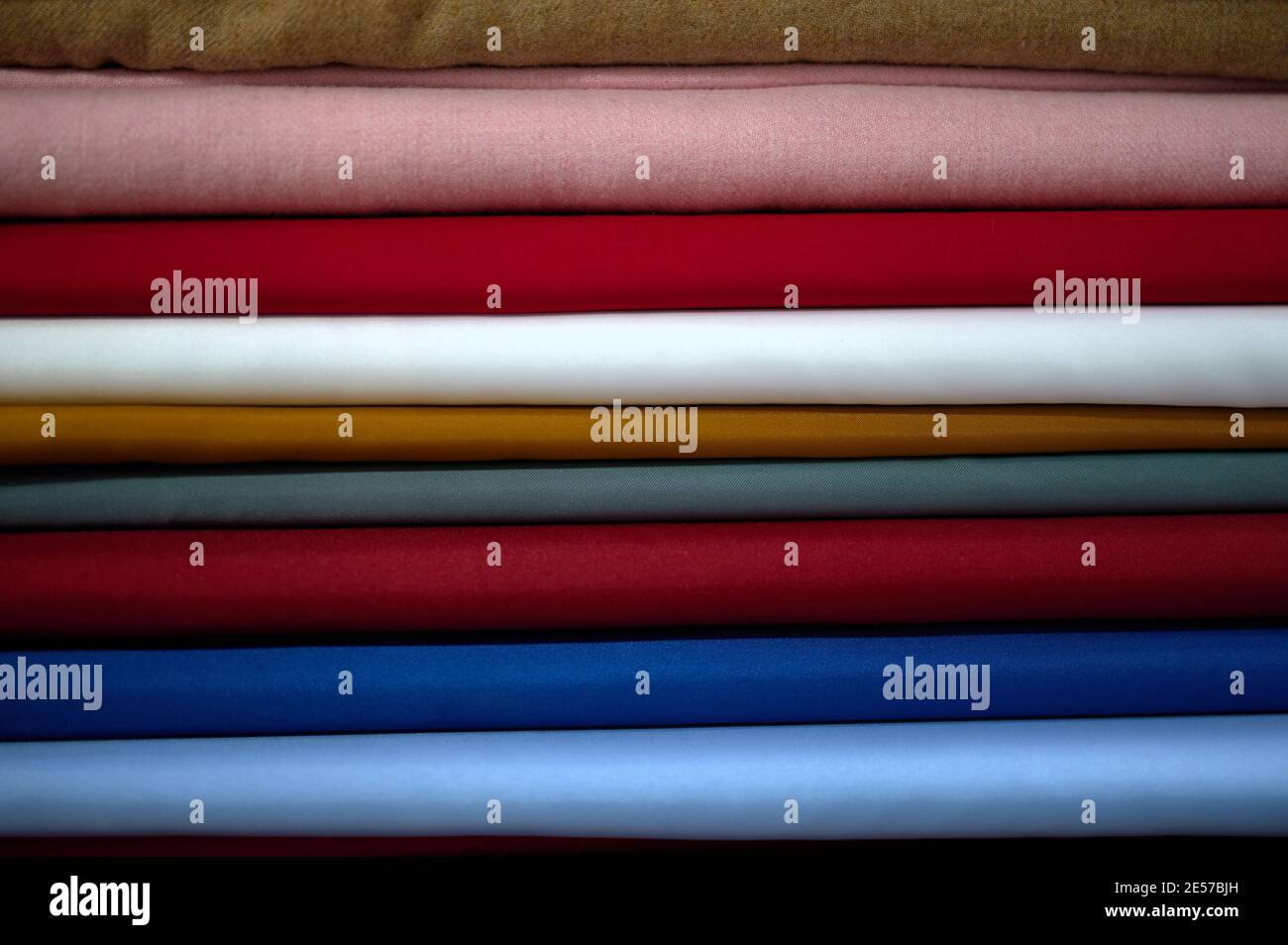 detail of fabric rolls for making suits and dresses of various colors