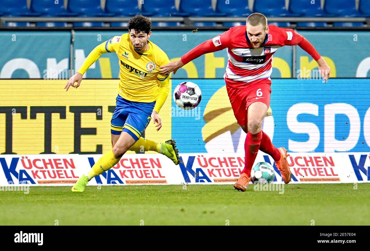Brunswick, Germany. 26th Jan, 2021. Football: 2. Bundesliga, Eintracht Braunschweig - 1. FC Heidenheim, Matchday 18 at Eintracht-Stadion. Heidenheim's Patrick Mainka and Braunschweig's Fabio Kaufmann (l) fight for the ball. Credit: Hauke-Christian Dittrich/dpa - IMPORTANT NOTE: In accordance with the regulations of the DFL Deutsche Fußball Liga and/or the DFB Deutscher Fußball-Bund, it is prohibited to use or have used photographs taken in the stadium and/or of the match in the form of sequence pictures and/or video-like photo series./dpa/Alamy Live News Stock Photo