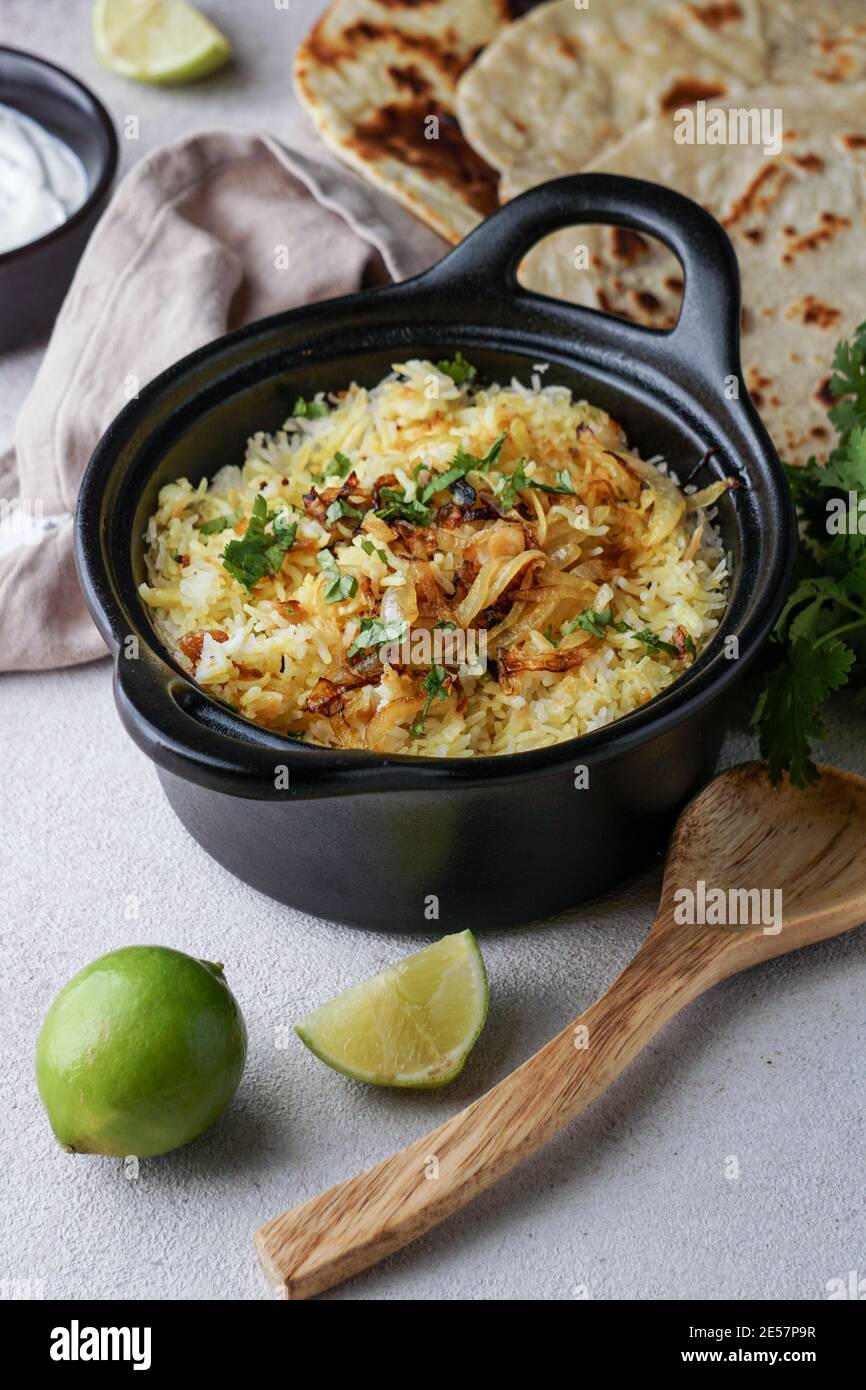 Chicken Biryani indian pilaf, with flat bread Stock Photo Alamy