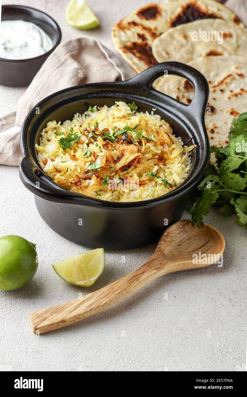 Chicken Biryani indian pilaf, with flat bread Stock Photo Alamy