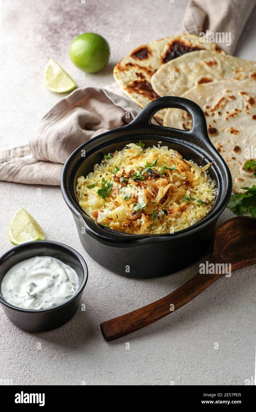 Chicken Biryani indian pilaf, with flat bread Stock Photo Alamy