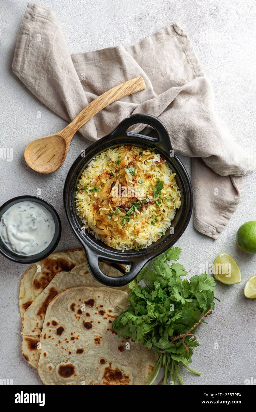 Chicken Biryani indian pilaf, with flat bread Stock Photo Alamy