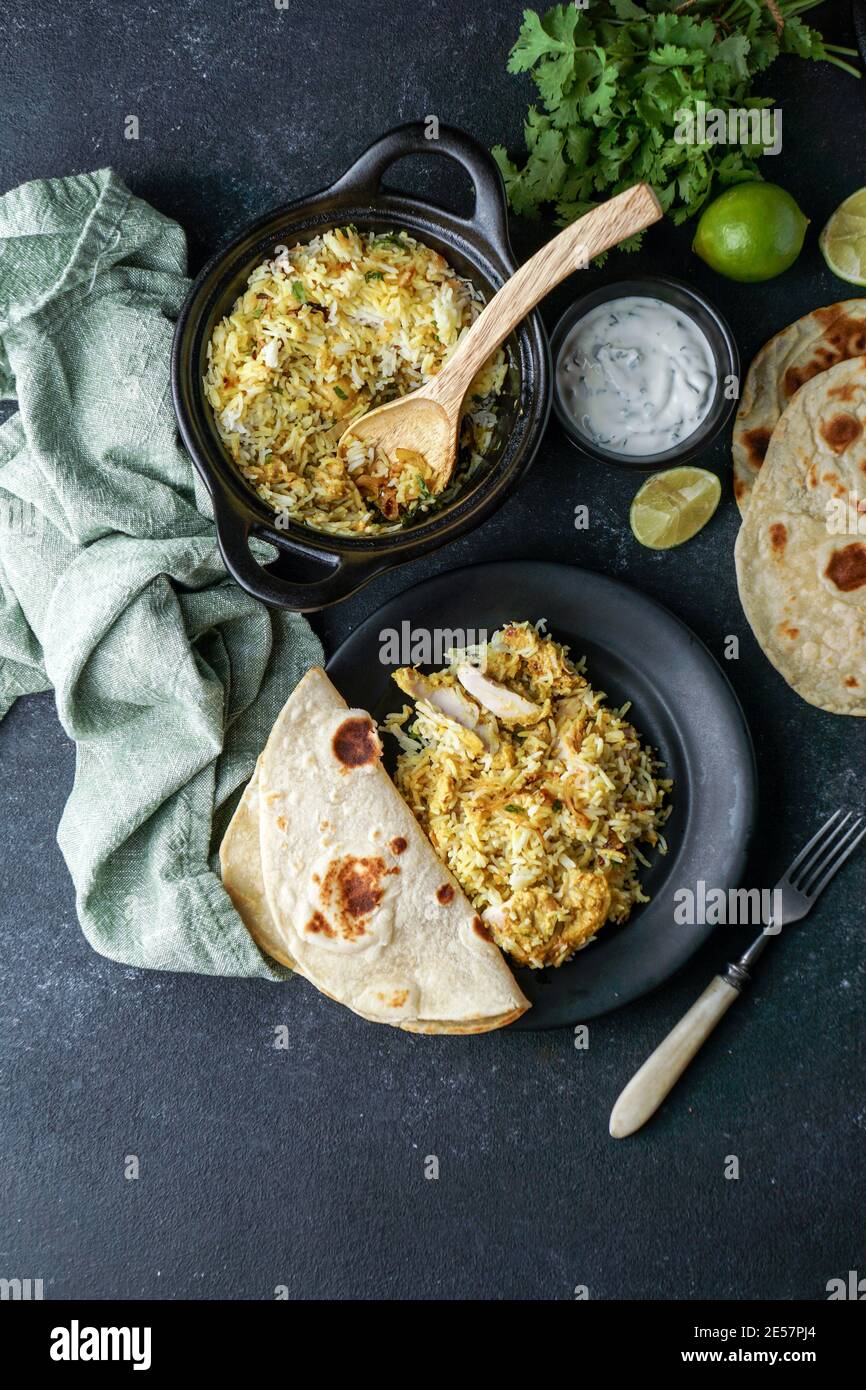 Chicken Biryani indian pilaf, with flat bread Stock Photo Alamy