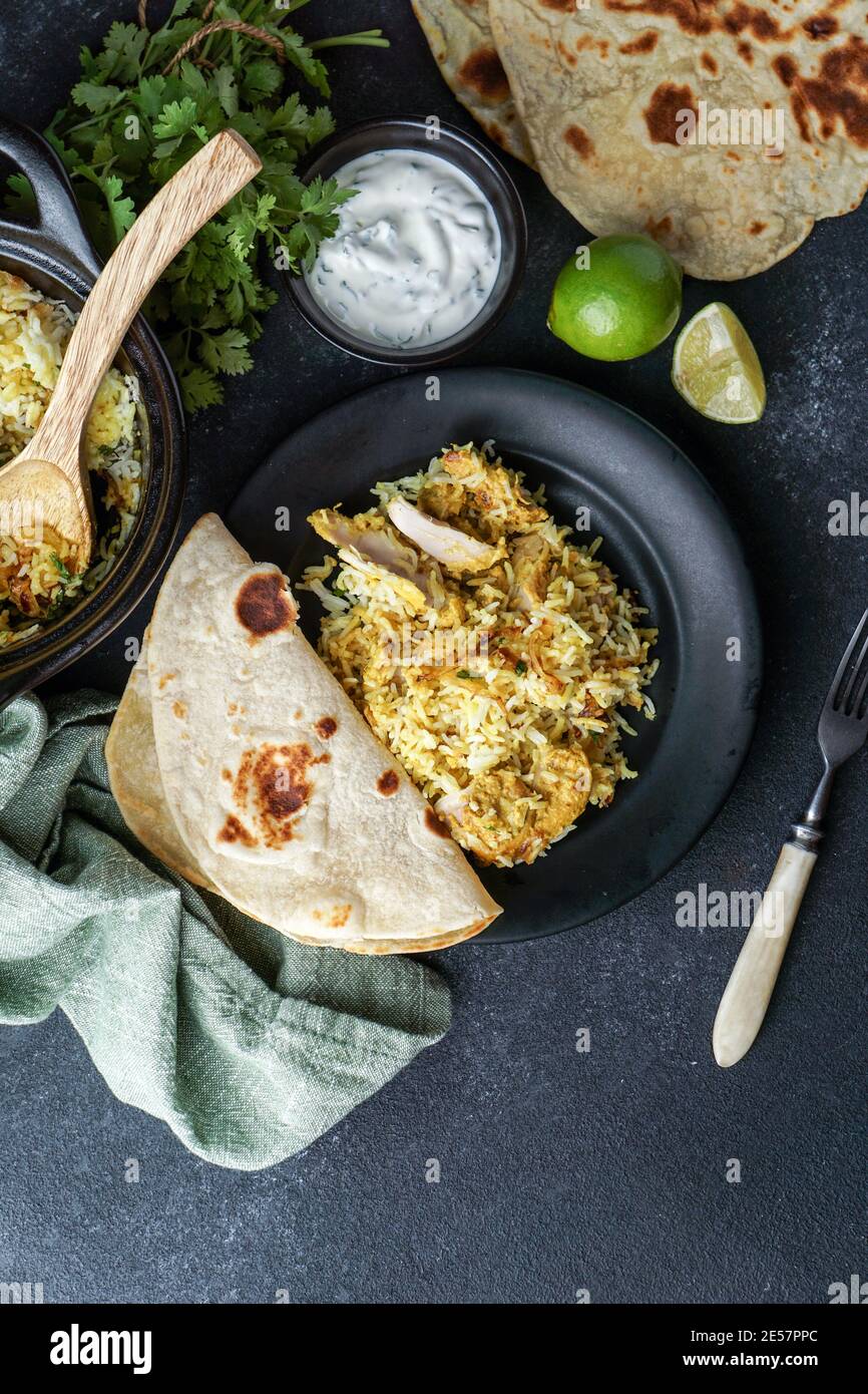 Chicken Biryani indian pilaf, with flat bread Stock Photo Alamy