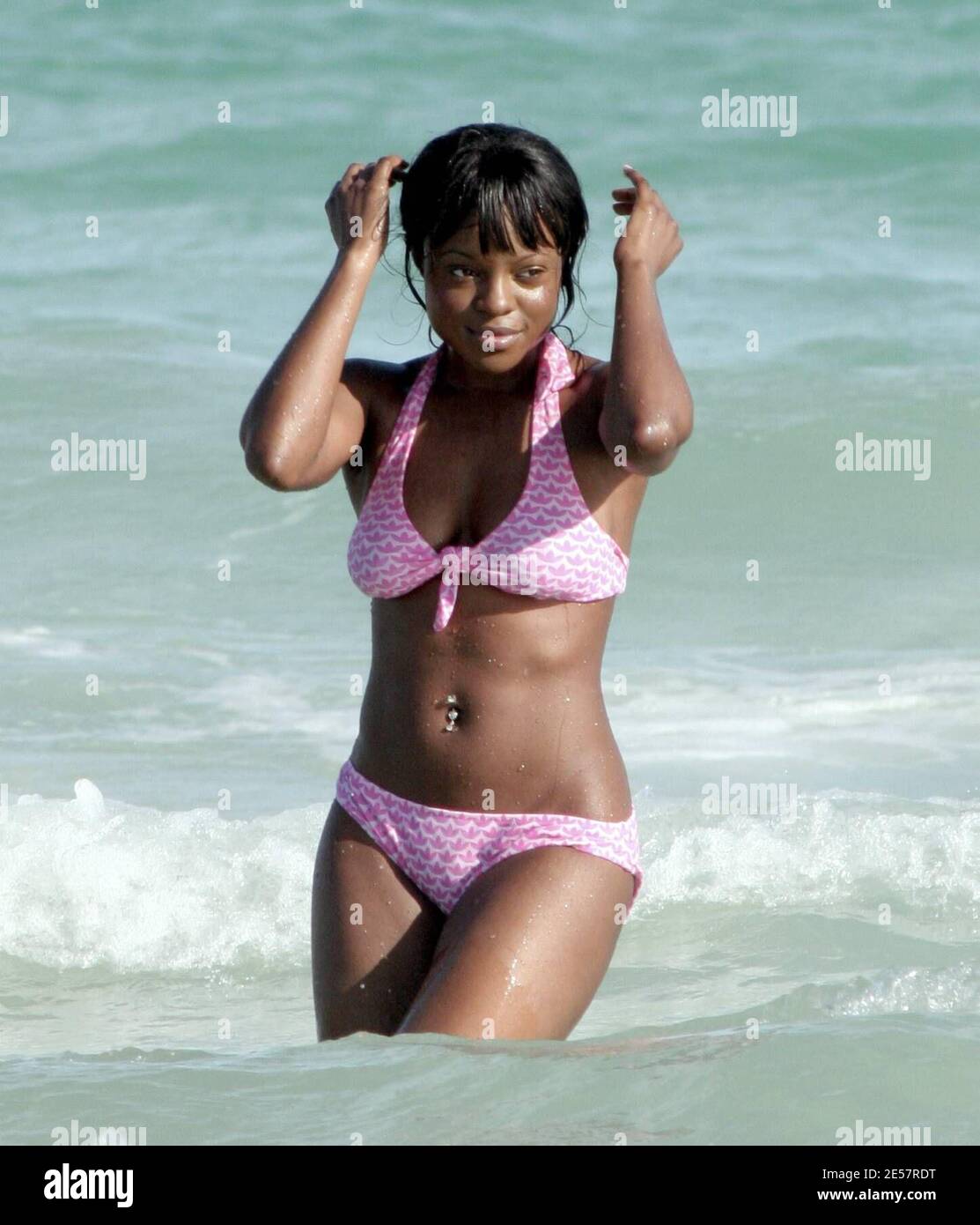 Waterbabe Keisha Buchanan enjoys a day on the beach in Miami, Fl with a  group of friends. The Sugababe singer looked pretty in pink as she  frolicked in the water and lounged