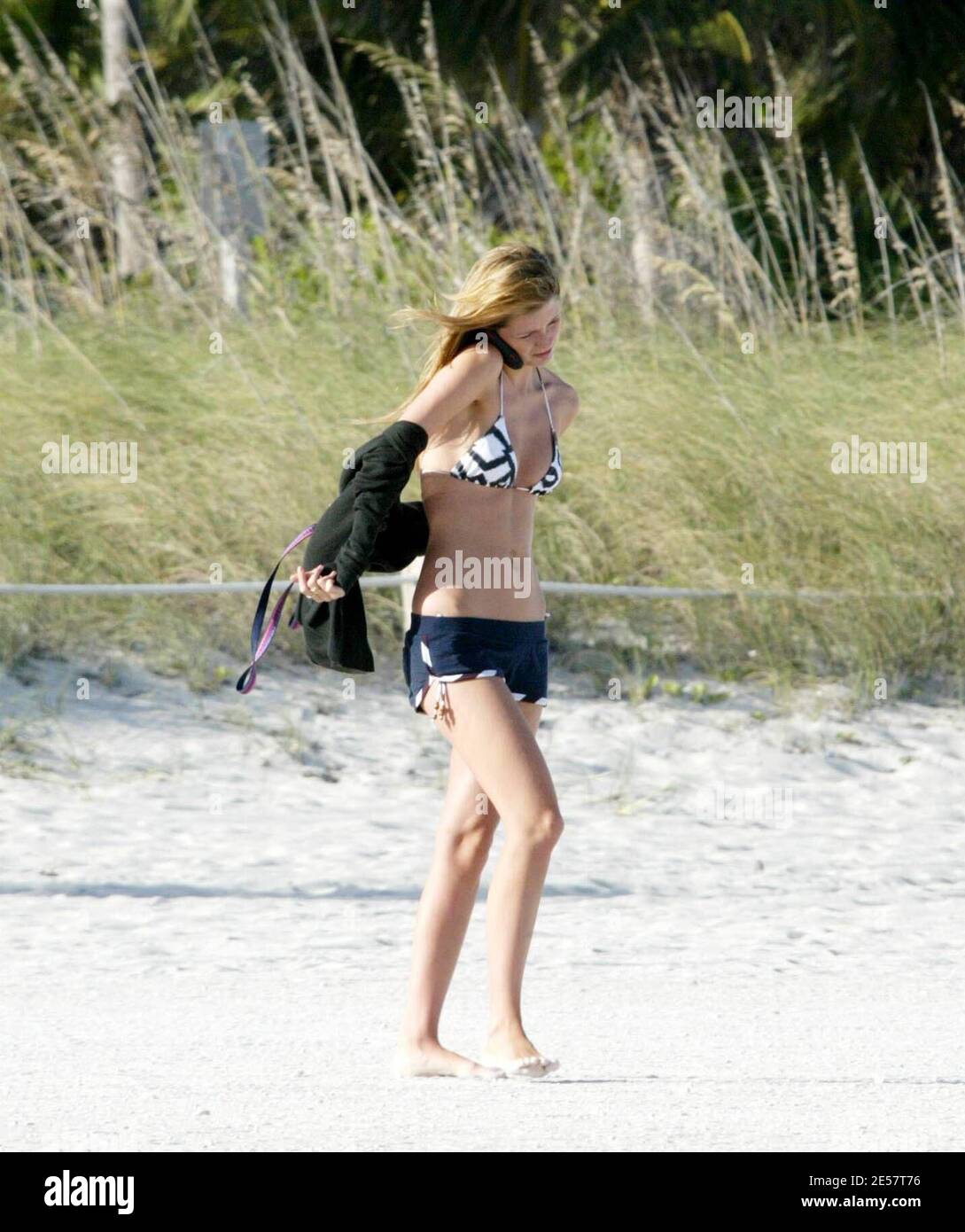 Exclusive!! UK superbabe Mischa Barton takes her dog Ziggy for a walk on Miami Beach. She was surprisingly unnoticed except for a few fans who asked her to pose for photos with them. 1/14/07    [[tag mab]] Stock Photo