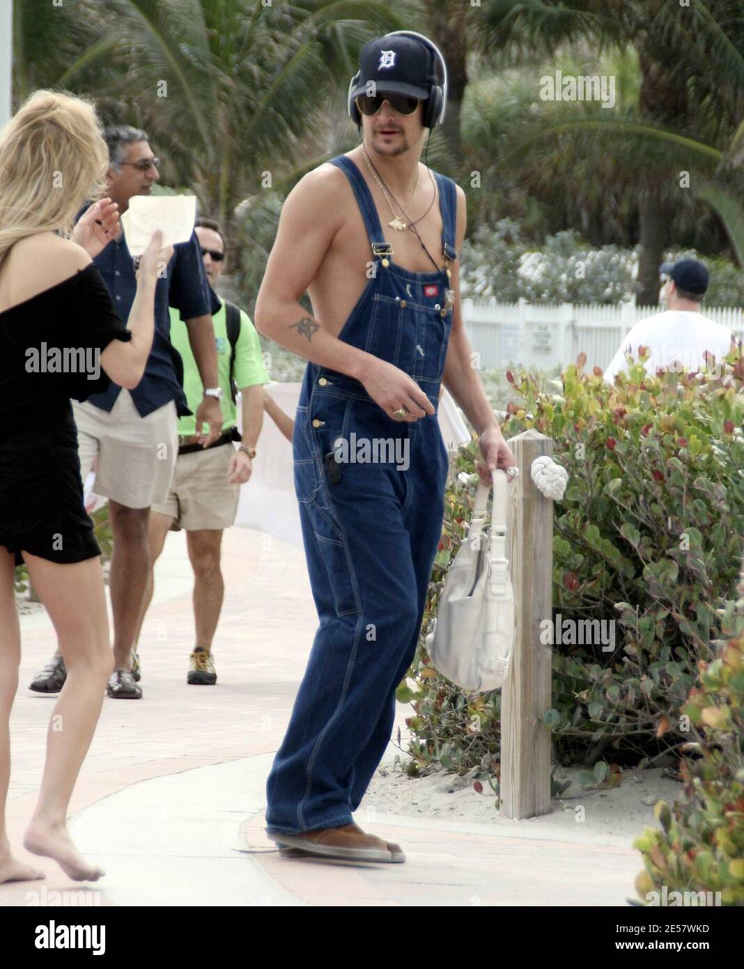 Kid Rock takes a stroll with Rande Gerber before borrowing an un-identified girl's handbag during Superbowl Weekend. Miami, FL 2/3/07.   [[rac ral]] Stock Photo