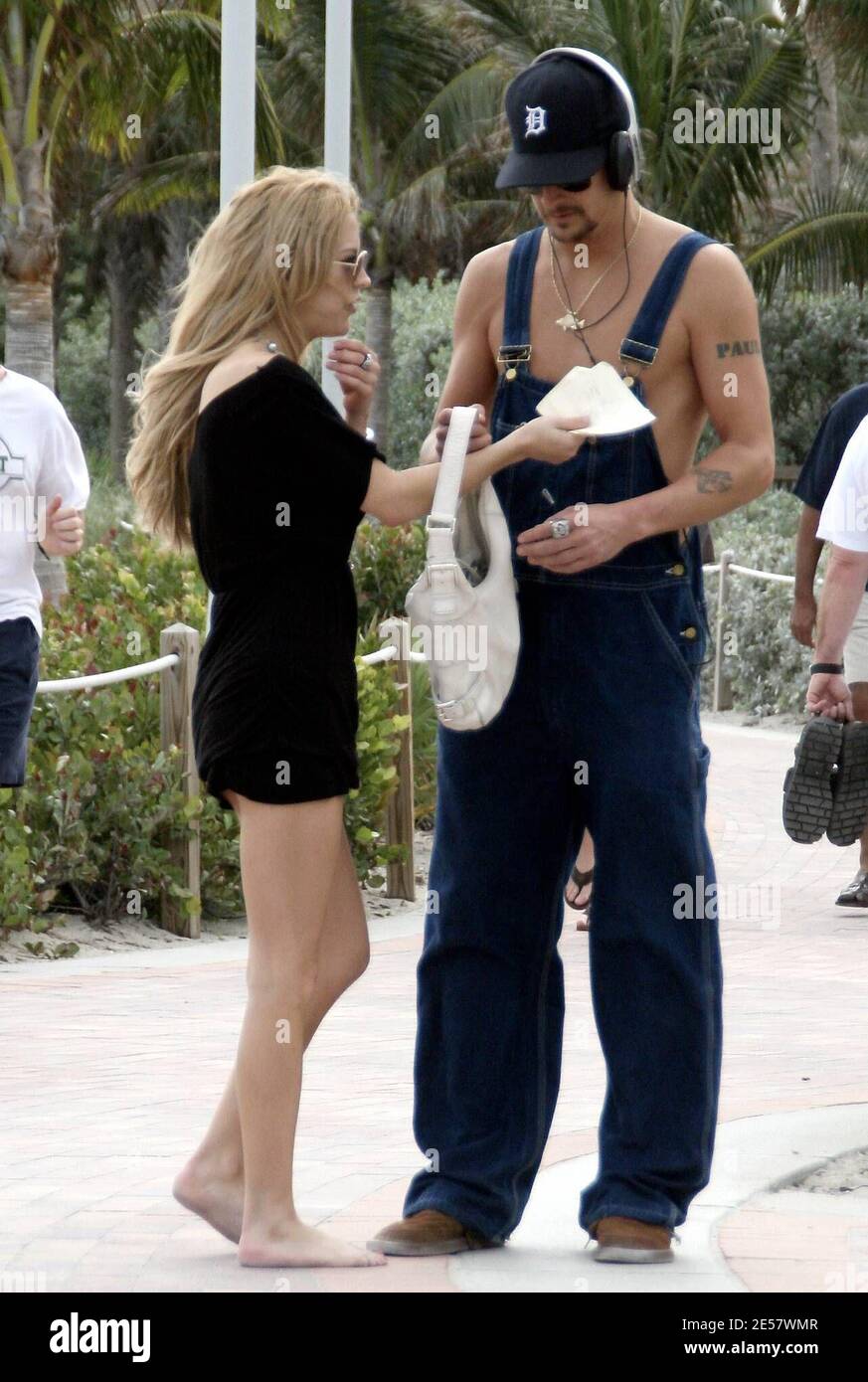 Kid Rock takes a stroll with Rande Gerber before borrowing an un-identified girl's handbag during Superbowl Weekend. Miami, FL 2/3/07.   [[rac ral]] Stock Photo
