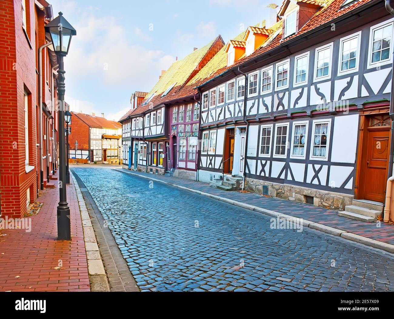 Explore traditional half-timbered houses, walking Gelber Stern street of Hildesheim, Germany Stock Photo
