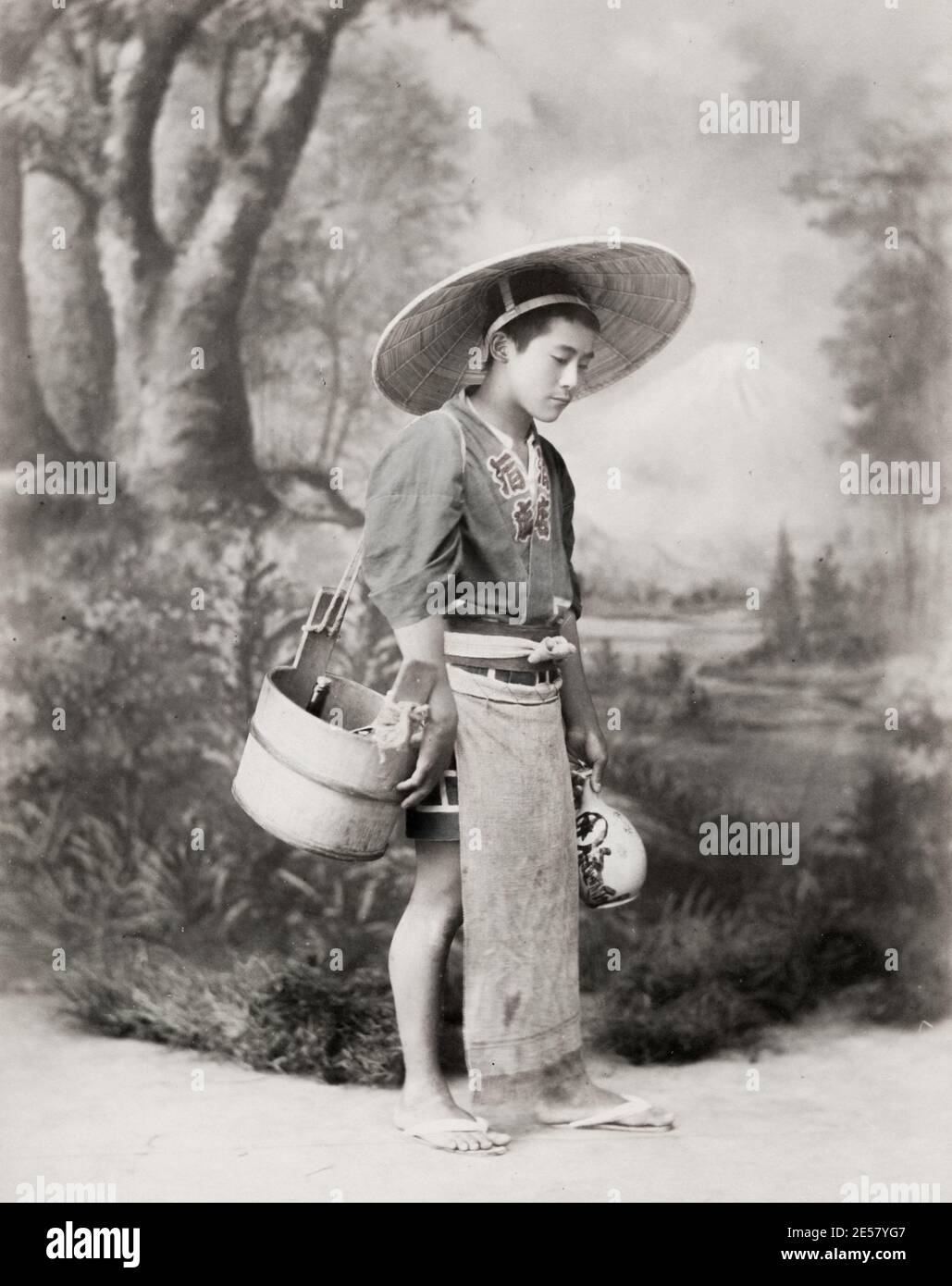 19th century vintage photograph: young man with wine flask, Japan. Stock Photo