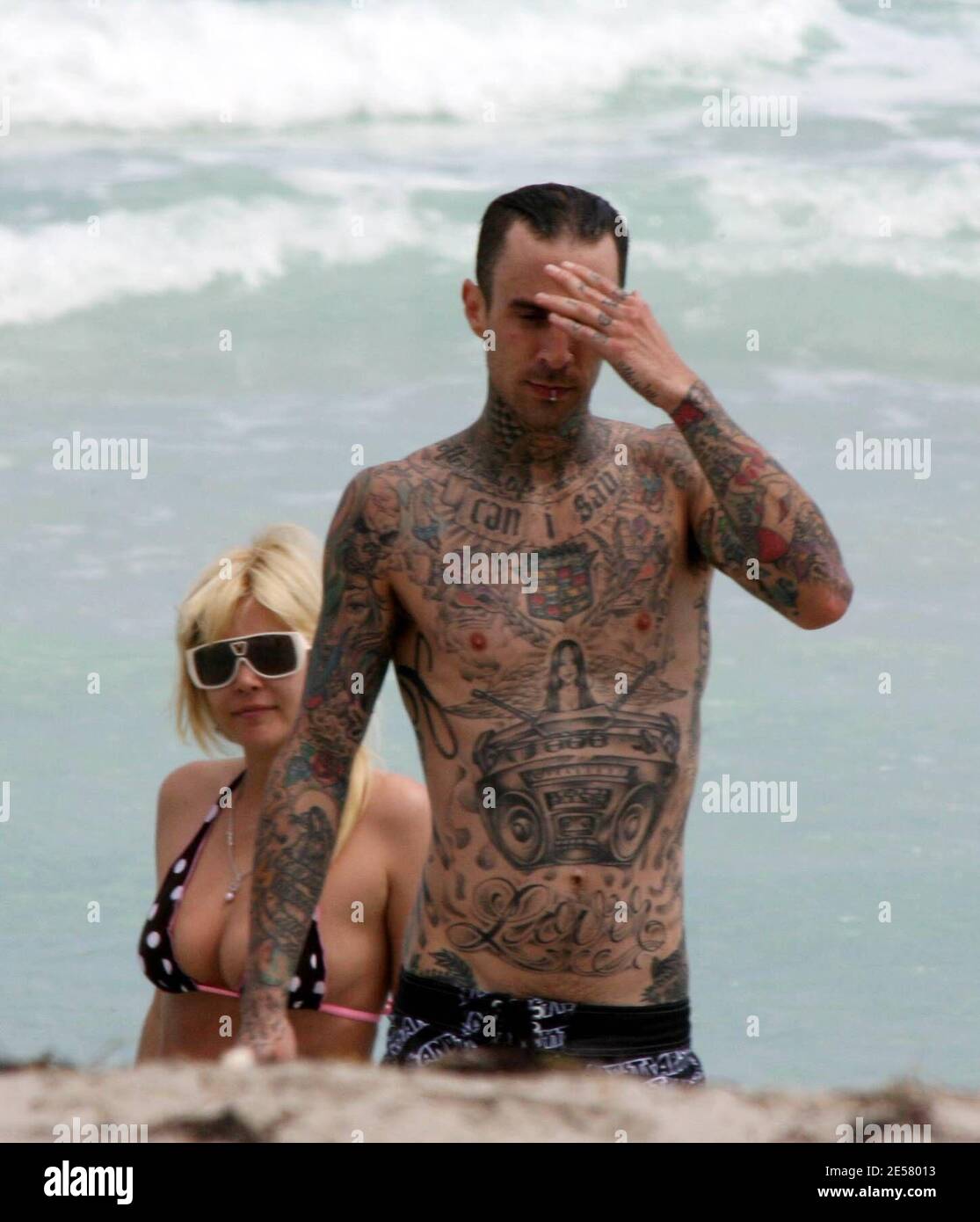 Exclusive!! Travis Barker and wife Shanna Moakler spend a second day on Miami Beach. The couple took a dip in the ocean and fooled around in their cabana before heading back to thier hotel, 3/19/07.    [[tag ccm]] Stock Photo