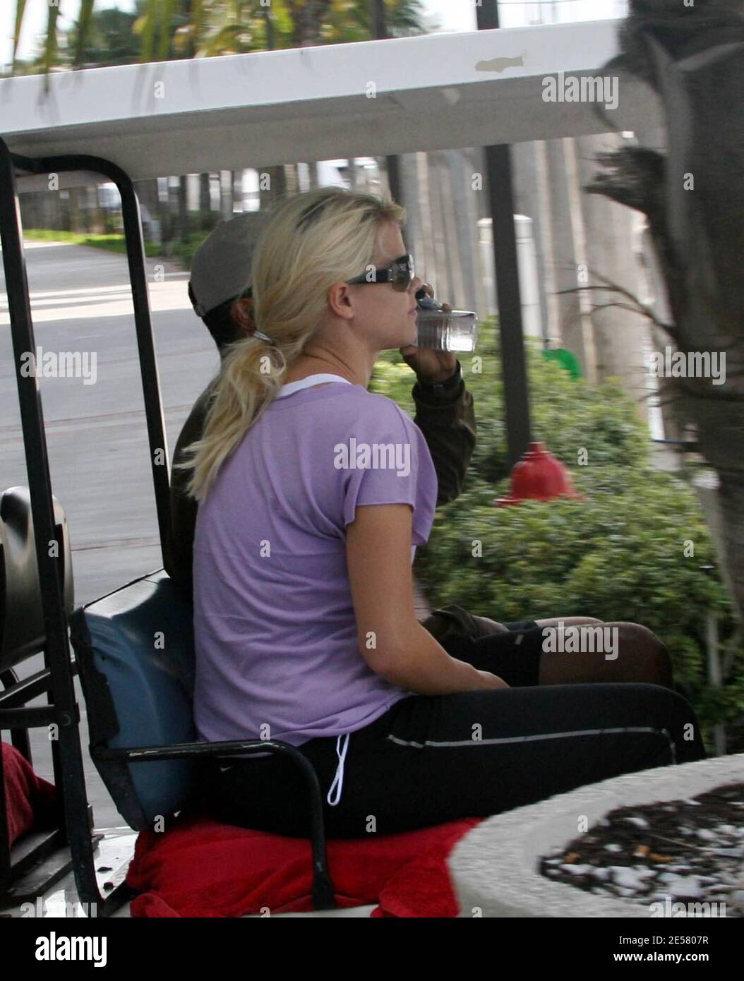 Exclusive!! Golfing superstar Tiger Woods and wife Elin take a break from their yacht 'Privacy' to go to a local gym. Even though Elin is pregnant and showing, she still likes to work out and keep in shape. Miami Beach, FL, 3/25/07    [[tag]] Stock Photo