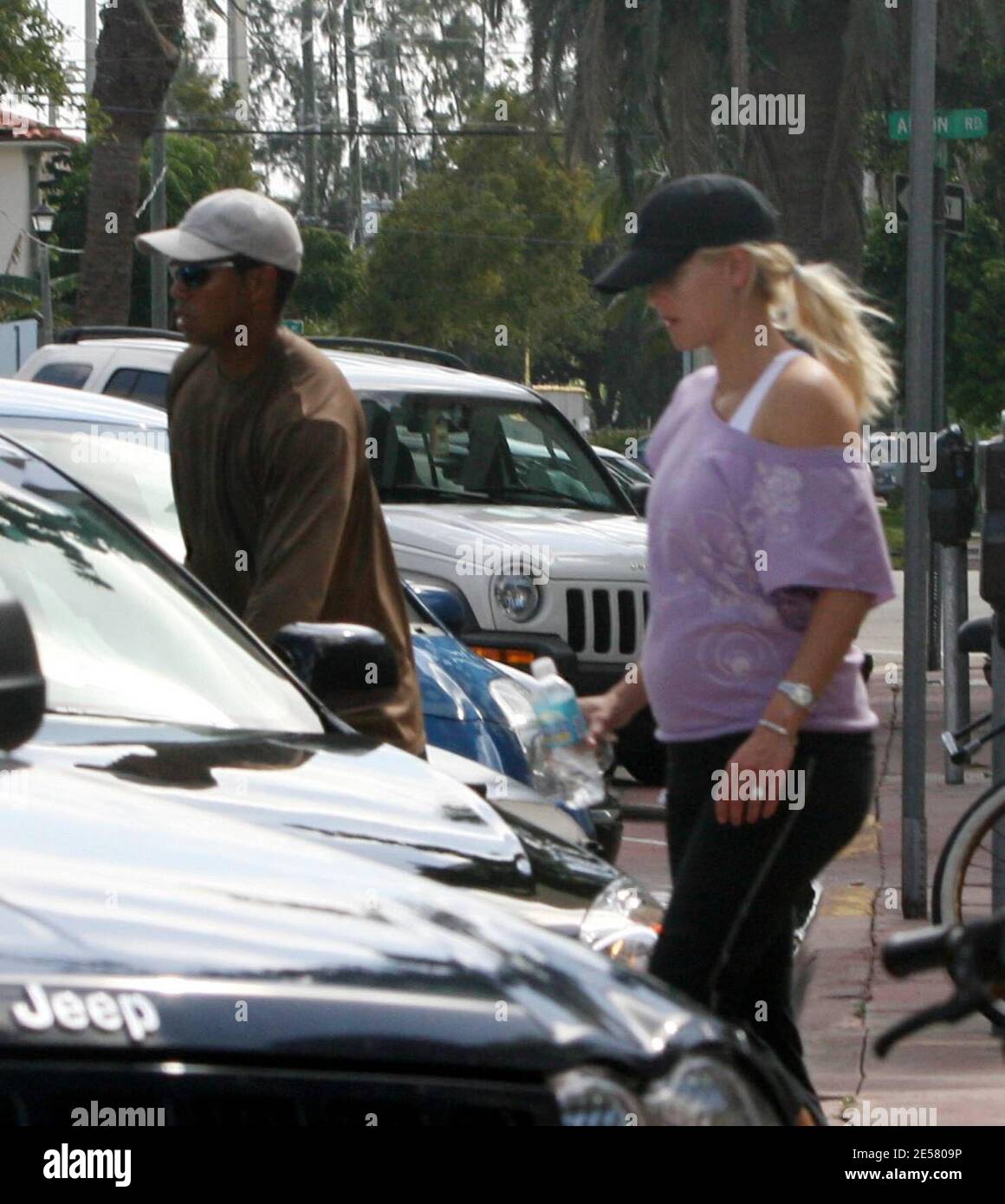 Exclusive!! Golfing superstar Tiger Woods and wife Elin take a break from their yacht 'Privacy' to go to a local gym. Even though Elin is pregnant and showing, she still likes to work out and keep in shape. Miami Beach, FL, 3/25/07    [[tag]] Stock Photo