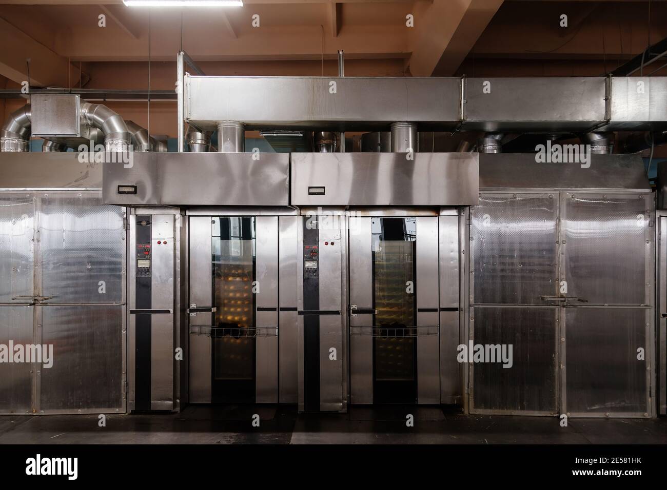 Modern bakery in confectionery factory. Industrial ovens for baking
