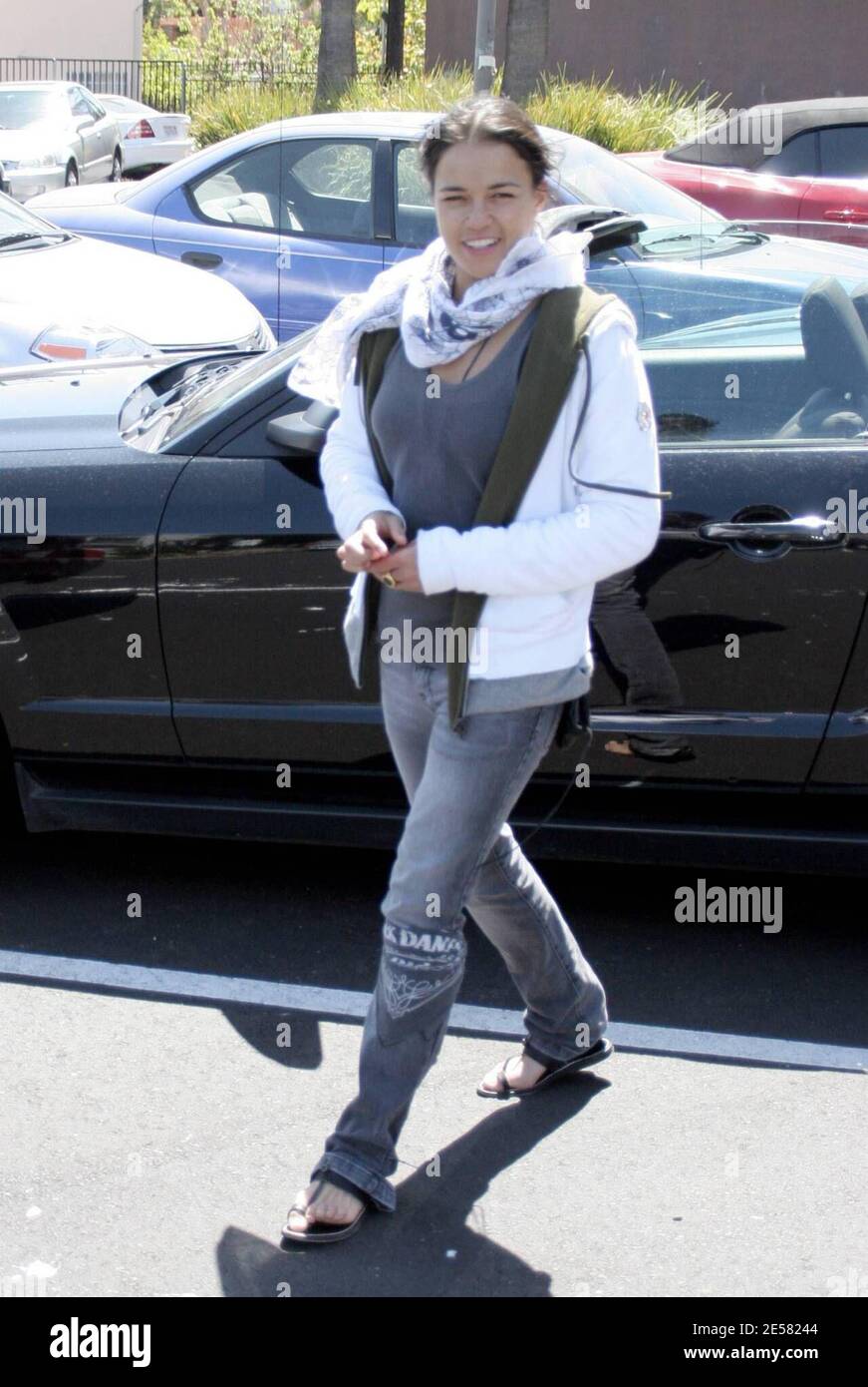 Exclusive!! Michelle Rodriguez makes her own fashion statements these days. The actress was spotted dropping off a bunch of shoes and boots at a custom design store in Hollywood, Ca. Rodriguez was also wearing a Jack Daniels bandana around her leg. 4/18/07    [[rac ral]] Stock Photo