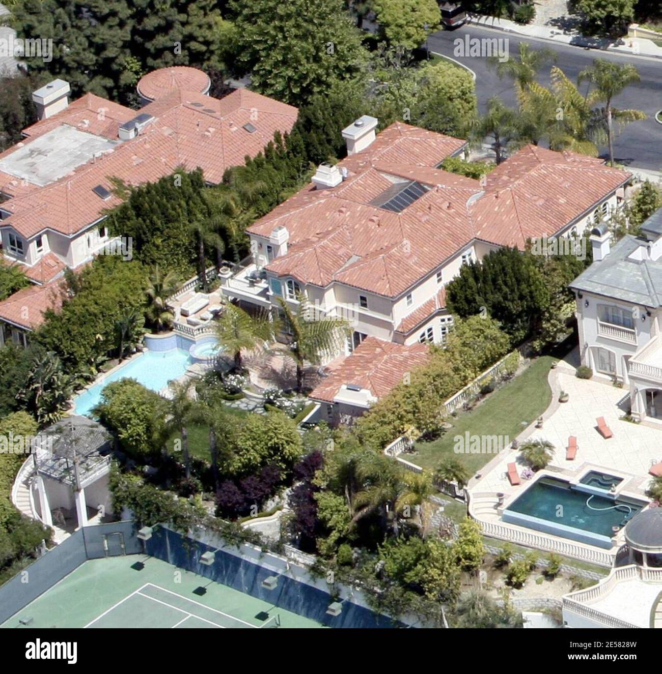 Exclusive!! Avril Lavigne and Deryck Whibley are selling their five bedroom, 6,864-square foot mansion in Beverly Hills, Ca. and moving up to a larger pad. Since they purchased a new home in Bel Air for $9.5 million they are keen to get this old property sold and have reduced the price from rom $6.9 million to $6.2 million. The new home has 8 Beds, 10.5 baths, plenty of room for the family that Avril has said she plans to have. 4/19/07    [[rac ral]] Stock Photo