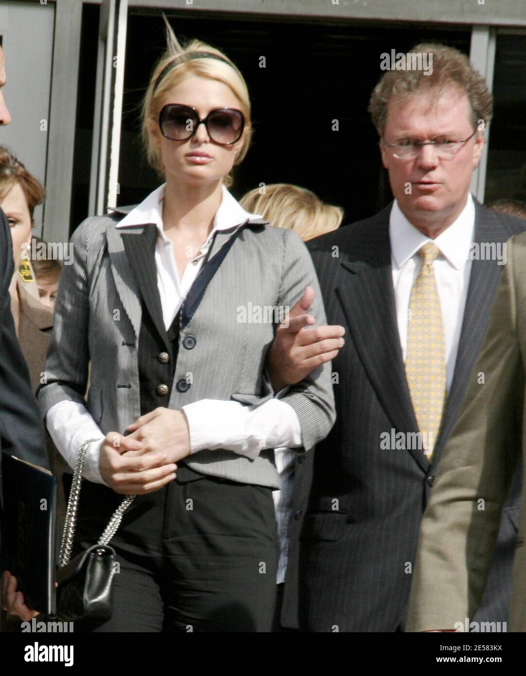 Paris Hilton broke down in tears today as she left a downtown Los Angeles, Ca. courtroom where she was  sentenced to 45 days in jail for driving with a suspended license. Hilton told the judge: "I'm very sorry and from now on I'm going to pay complete attention to everything...I did not do it on purpose at all." Paris needed to be physically supported by her father as she exited the building and held her head high as tears streamed down her face but it wasn't until she was inside her car that Paris broke down sobbing. Also attending the probation revocation hearing was Paris' mother Kathy. 5/4 Stock Photo